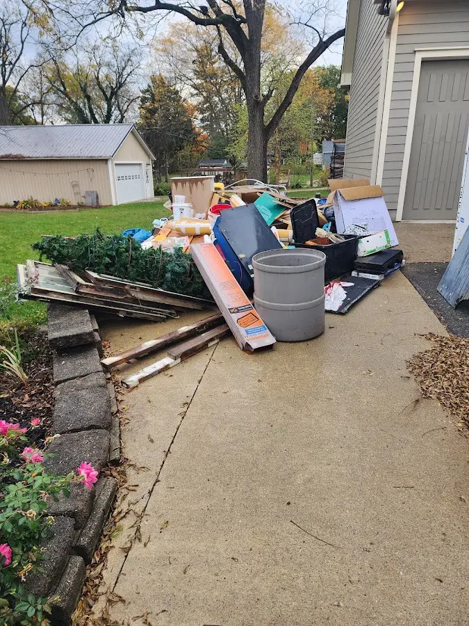Dumpster being loaded with debris for 3 Yard Dumpster Rental in Lemmon Valley